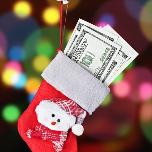 A picture of Christmas stocking stuffed with money