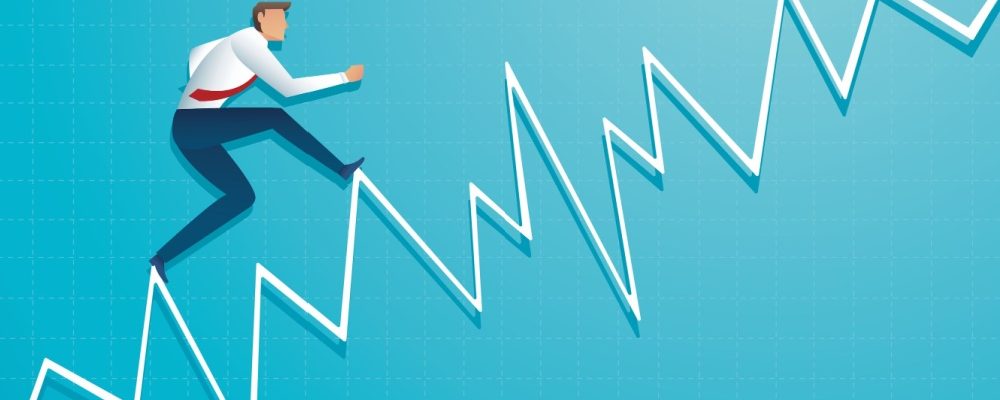 This a picture of a businessman running up and down on a graph