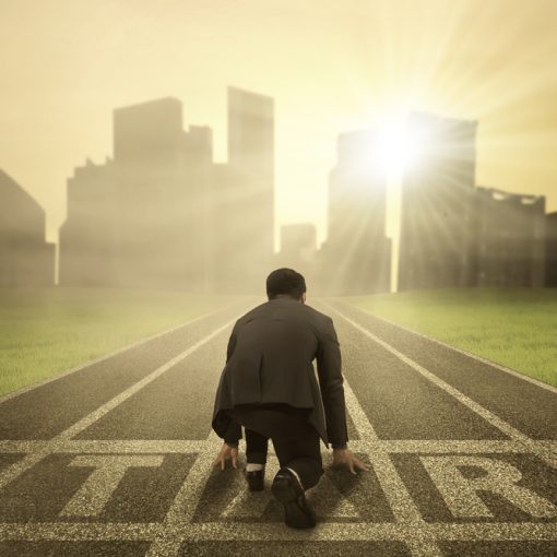 This is a pic of a business person ready to run from start position