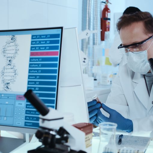 This is a pic of a scientist working in a futuristic biotech setting