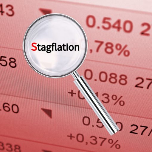 The image shows the a magnifying lens atop the text Stagflation