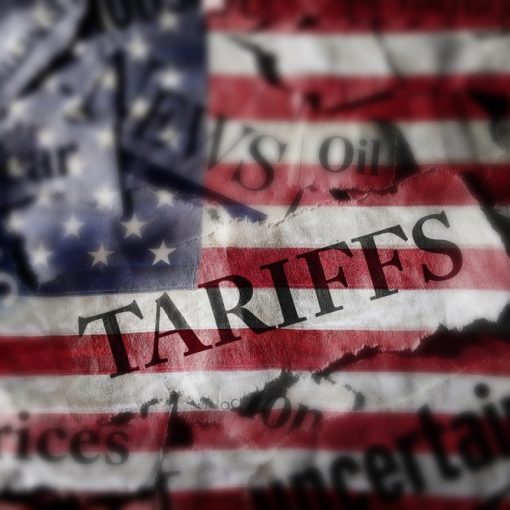 This image shows Tariffs News scrawled over US Flag