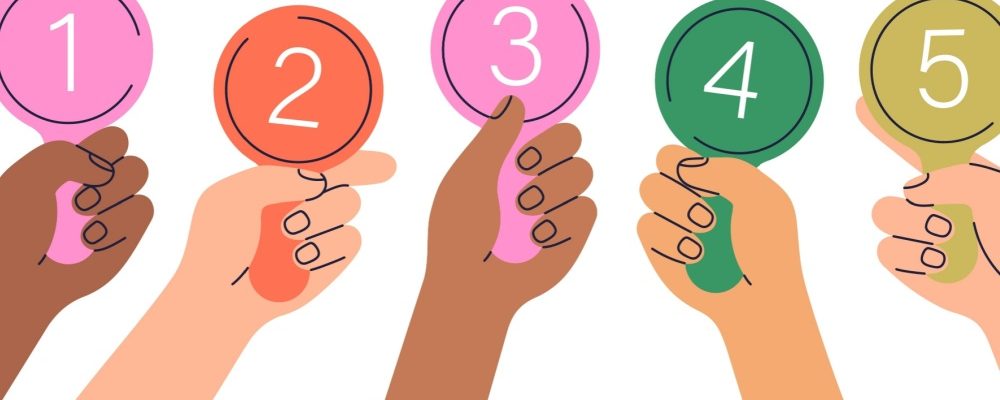 The image shows hands holding five scores