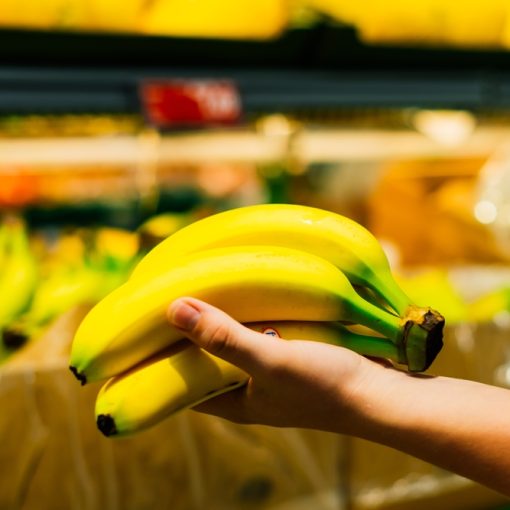 The image shows a bunch of bananas in shop