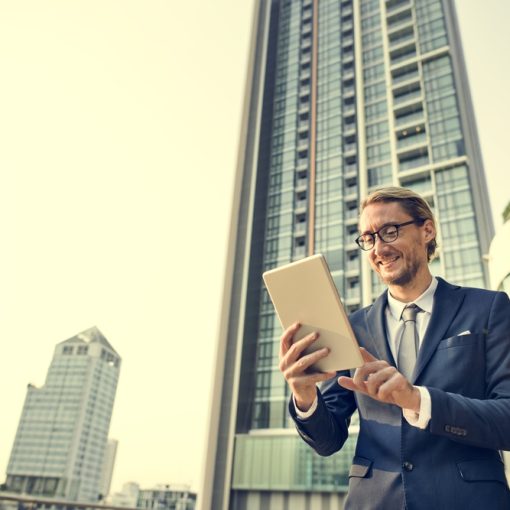 The image shows a businessman looking happy