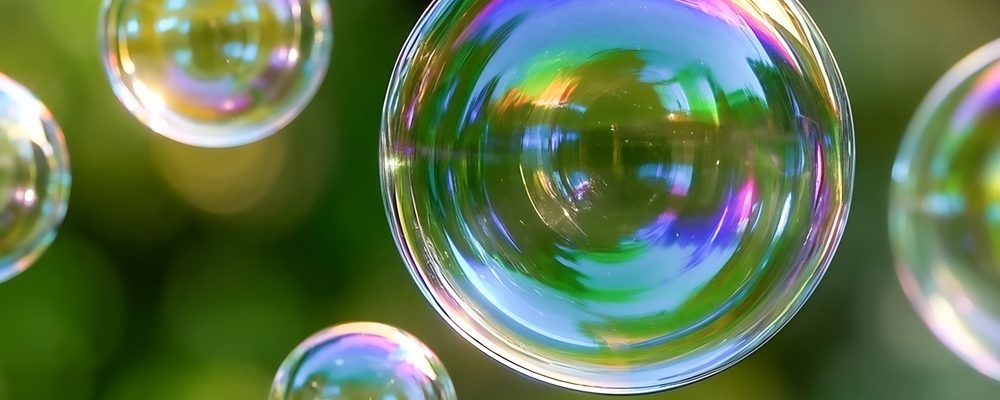 The image shows colorful soap bubbles