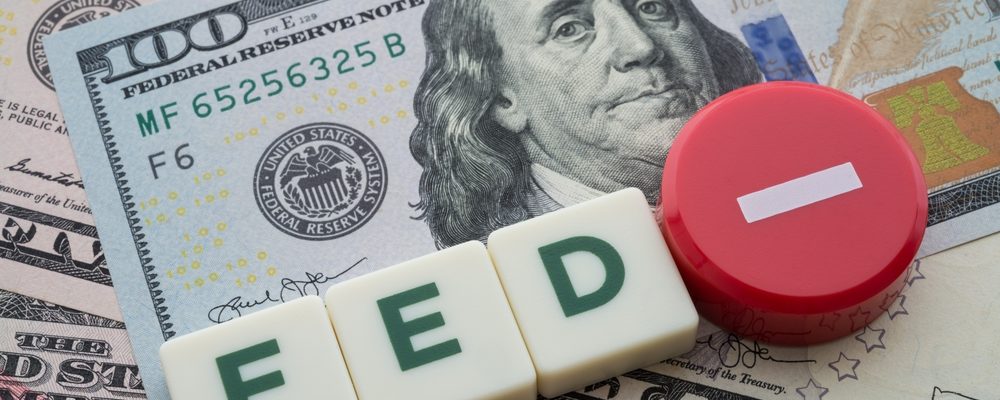 The image shows letters FED with minus sign for rate cut