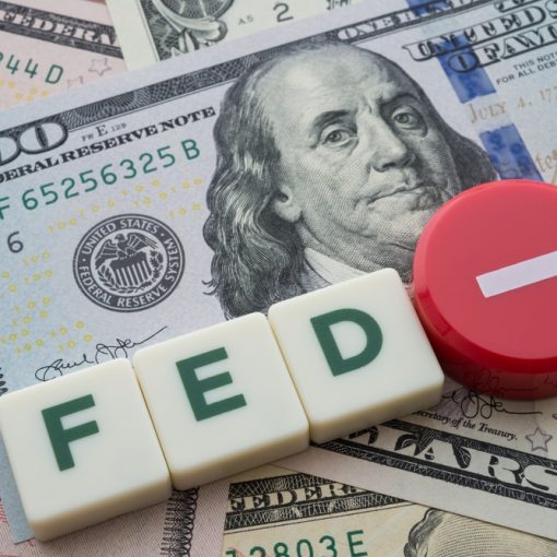 The image shows letters FED with minus sign for rate cut