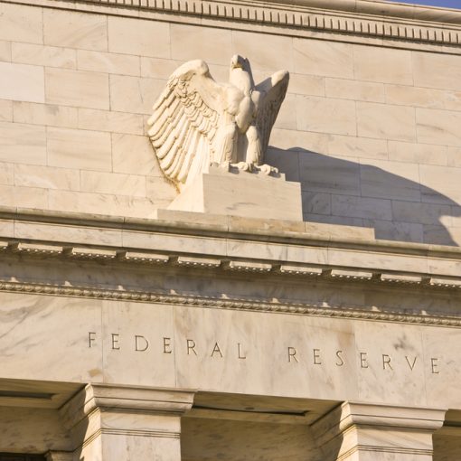 The image shows the Federal Reserve building