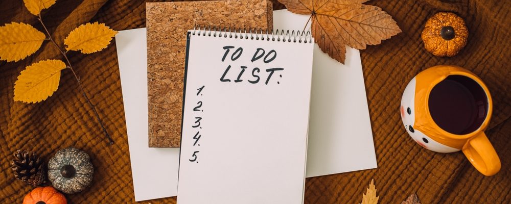 Image shows Autumn fall leaves with to do list