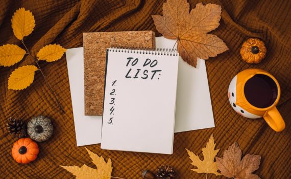 Image shows Autumn fall leaves with to do list