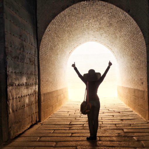 The image shows a person seeing light at the end of tunnel