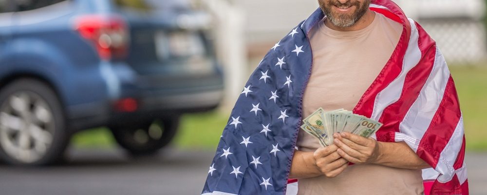 The image shows an American man with money