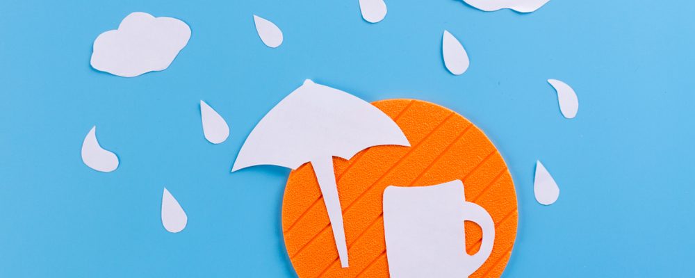 Rain on Umbrella covering Drink