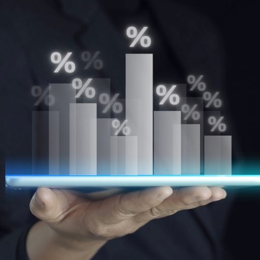 The image shows a hand holding Market Sales Charts in Black