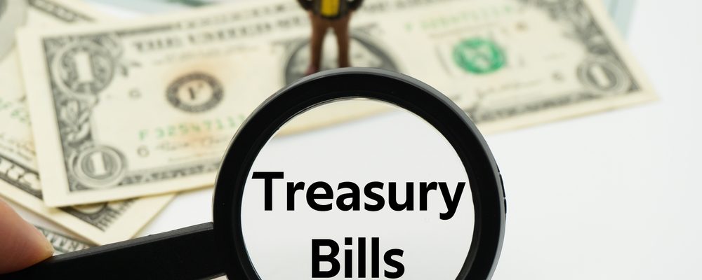 The image shows the text Treasury Bills under Magnifying Glass