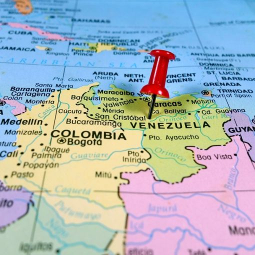 The image shows a pushpin marking Venezuela on map