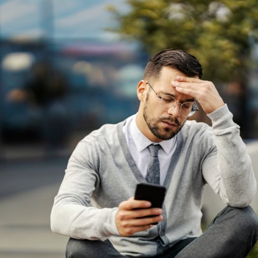 The image shows a disturbed, worried looking businessman