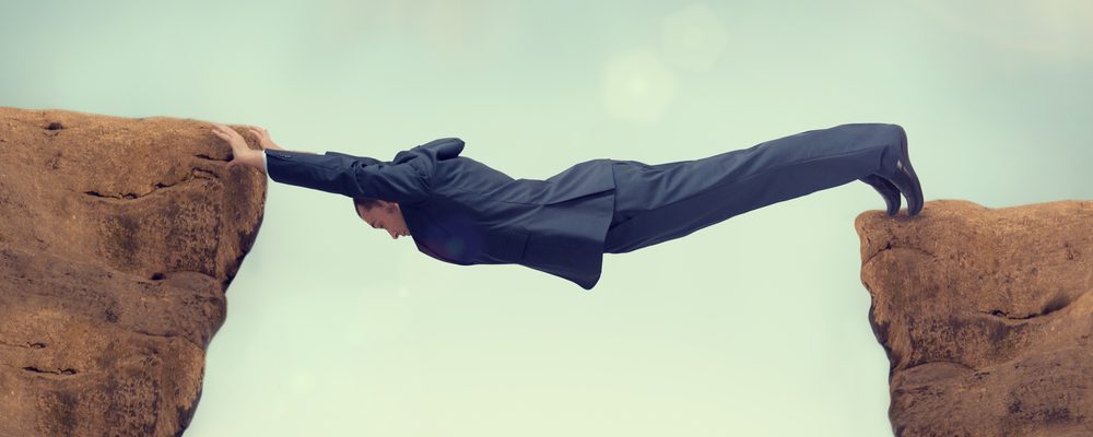 Businessman Between Rock And Hard Space
