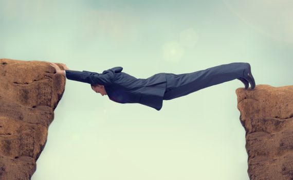 Businessman Between Rock And Hard Space