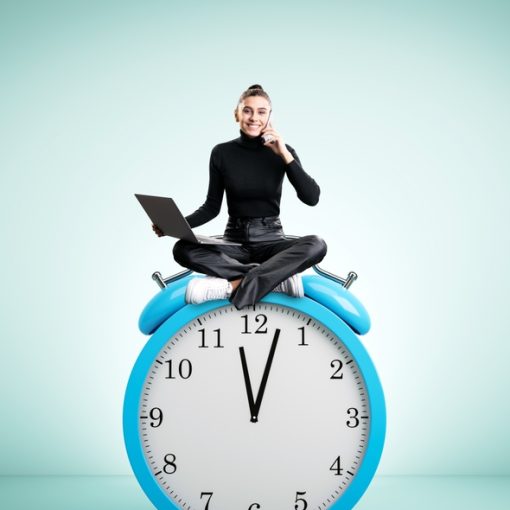 Woman Sitting on a Clock with Laptop