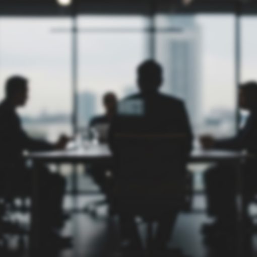 The image shows a worried group of businesspeople in discussion