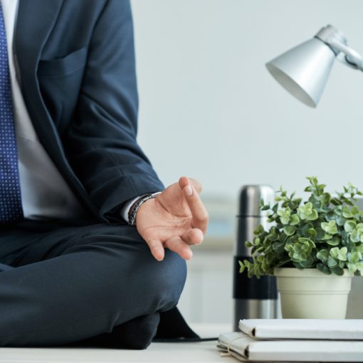 Businessman sitting in lotus position