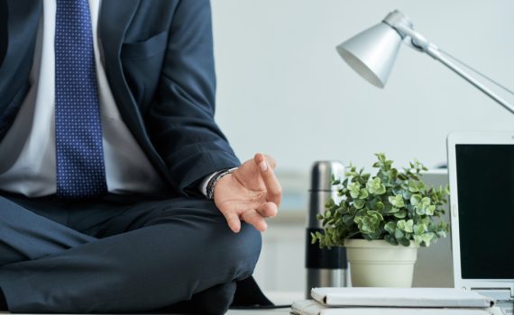 Businessman sitting in lotus position