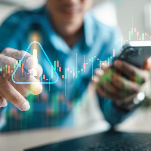 The image shows an investor holding smartphone, with caution towards stock market