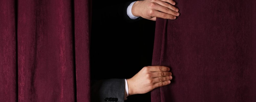 Hands Closing Curtains