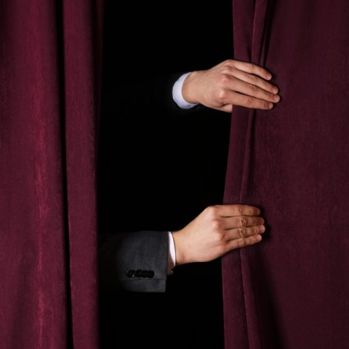 Hands Closing Curtains
