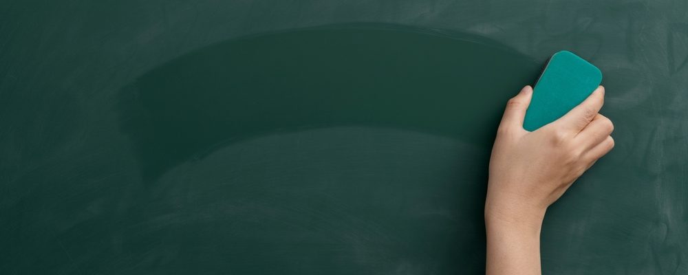 Hand with Duster Erasing Chalkboard