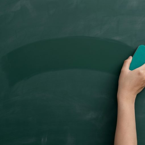 Hand with Duster Erasing Chalkboard