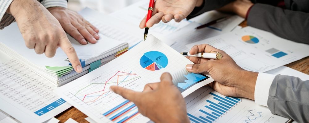 People Meeting to Discuss Graphs