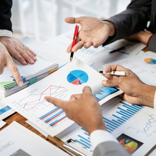 People Meeting to Discuss Graphs