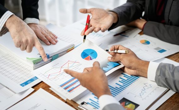 People Meeting to Discuss Graphs
