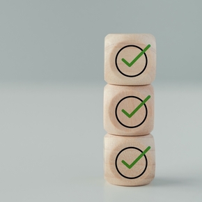 Stack of Three Dices with Checkmarks